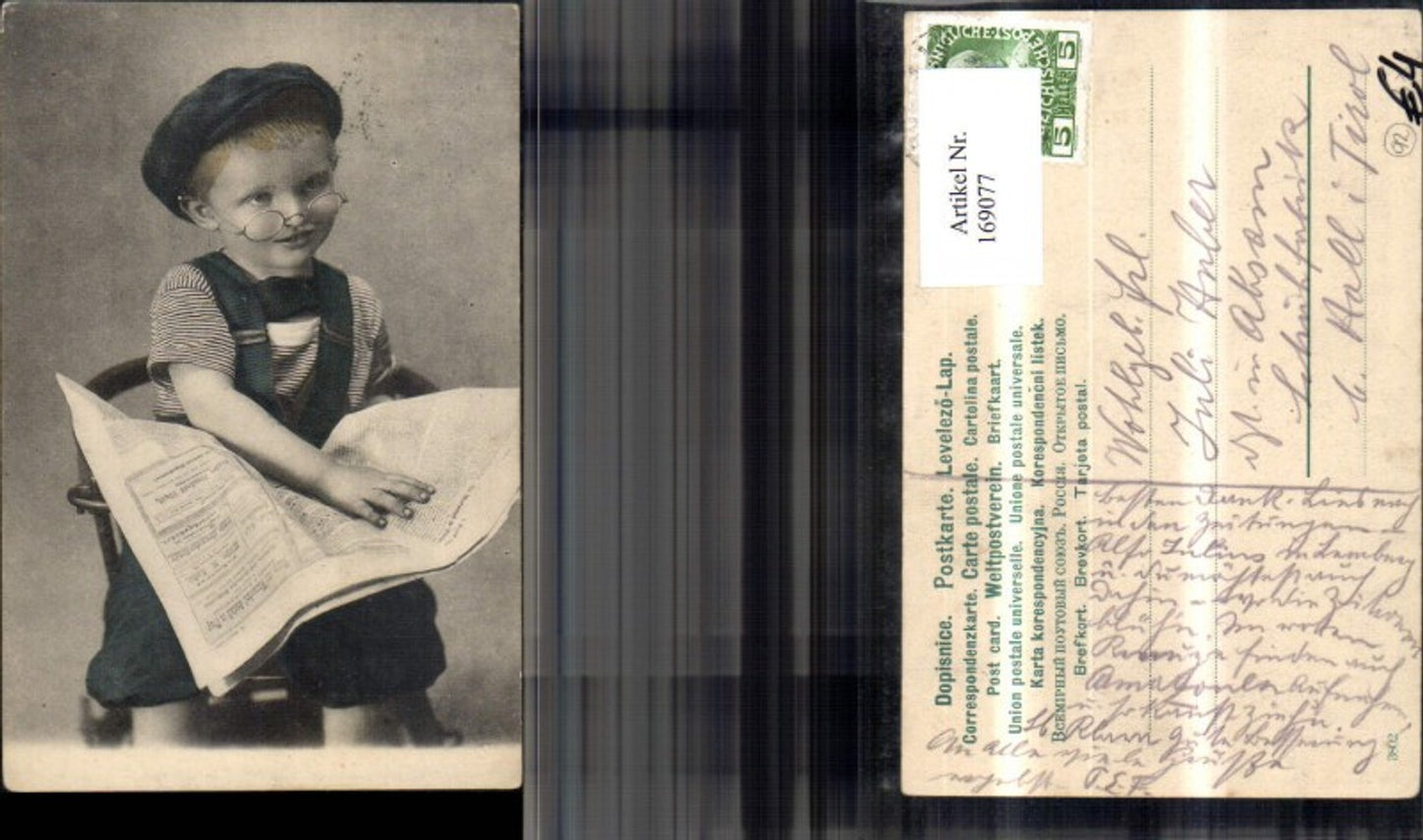169077, Child boy reading newspaper, glasses, hat
