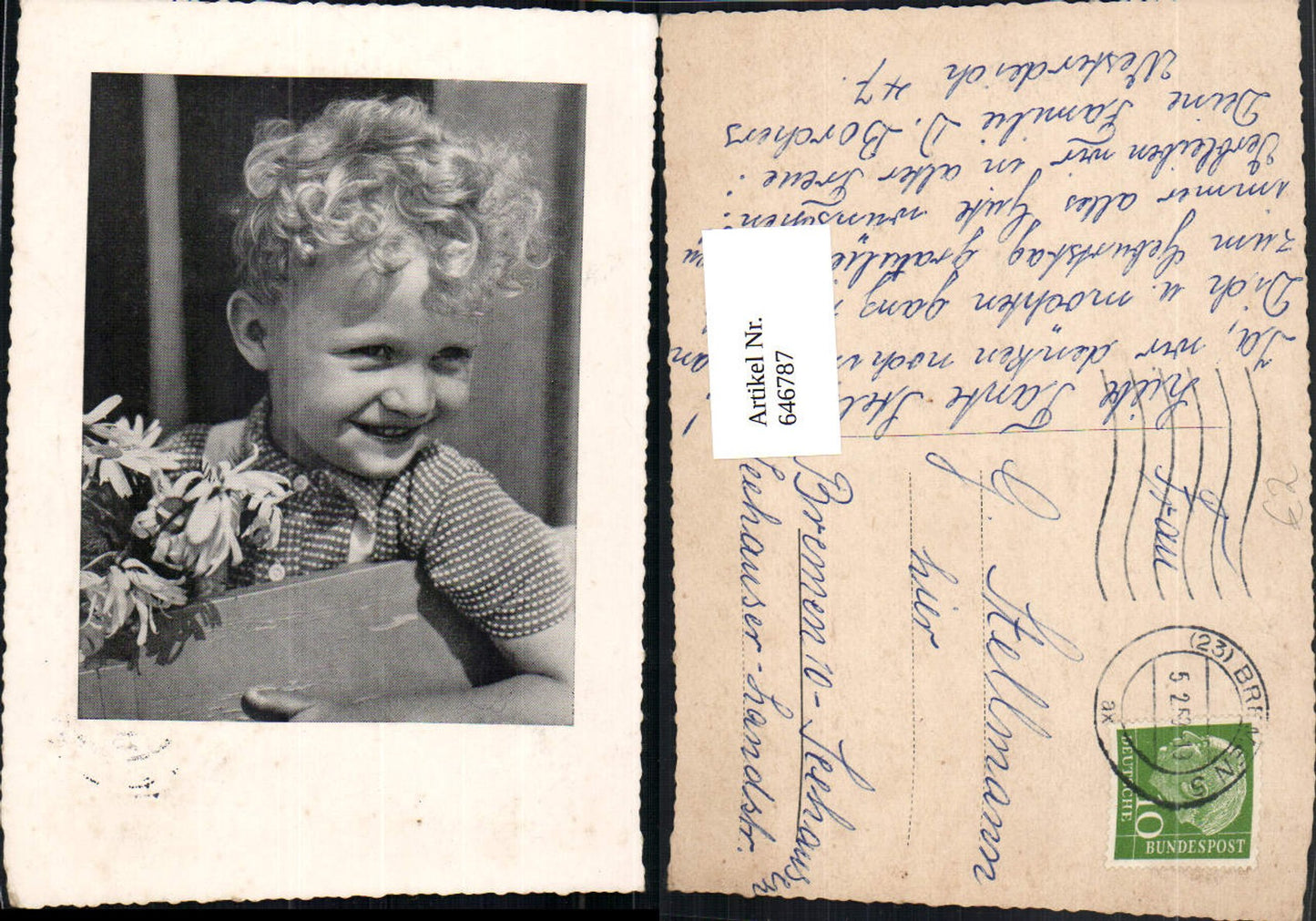 646787,Blonde curly-haired boy with flowers daisies