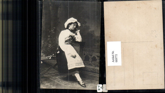 669772, Photo Ak Woman in traditional costume bonnet portrait